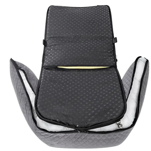 small dog resting on car seat travel bed cushion during road trip
